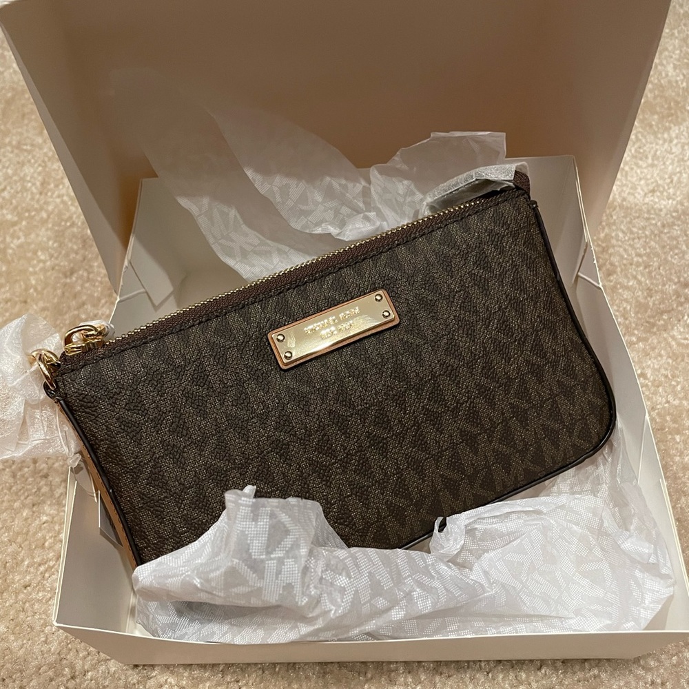 Michael Kors pouches and clutch. NWT.